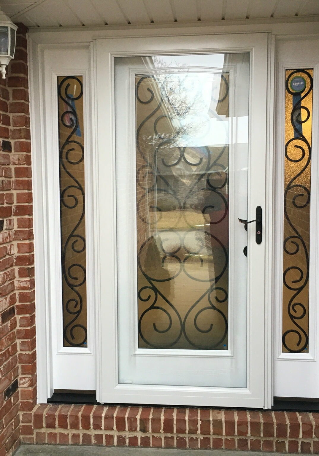 Exterior Door with Double Sidelites and Storm Door by Doors-N-More